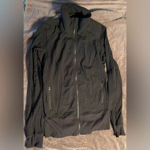 Lululemon stand up collar long body jacket. Thumb holes to cover hands GUC